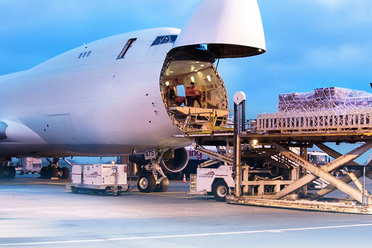 Palletised air cargo being loaded through the nose door of a freighter aircraft